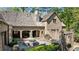 Picturesque backyard with outdoor seating, fountain, stone patio, and grill at 105 Kingston Mnr, Atlanta, GA 30342