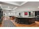 Spacious basement area featuring a bar with stainless steel appliances, seating and entertaining space at 105 Kingston Mnr, Atlanta, GA 30342