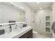 Modern bathroom featuring an illuminated mirror and glass enclosed shower at 105 Kingston Mnr, Atlanta, GA 30342