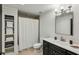 Bright bathroom with ample storage, black vanity and modern fixtures at 105 Kingston Mnr, Atlanta, GA 30342