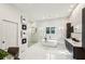 A luxurious bathroom features a standalone tub, glass-enclosed shower, and double vanity with contemporary finishes at 105 Kingston Mnr, Atlanta, GA 30342