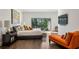 Bright bedroom features a large window with a view, a mounted TV, and sleek, modern furnishings at 105 Kingston Mnr, Atlanta, GA 30342