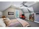 Comfortable bedroom with a ceiling fan, sloped ceilings, and cozy decor at 105 Kingston Mnr, Atlanta, GA 30342