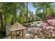 Beautiful home with blooming landscaping lining the driveway at 105 Kingston Mnr, Atlanta, GA 30342