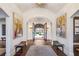 Spacious foyer with brick floors, bench seating, neutral walls, and an arched entryway with double doors to the exterior at 105 Kingston Mnr, Atlanta, GA 30342