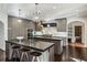 Gourmet kitchen featuring double islands with sleek countertops and high-end stainless steel appliances at 105 Kingston Mnr, Atlanta, GA 30342