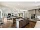 Open-concept kitchen featuring double islands, modern appliances, and seamless flow to the living area at 105 Kingston Mnr, Atlanta, GA 30342