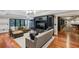 Relax in this living room with hardwood floors, and an entertainment center and two sofas at 105 Kingston Mnr, Atlanta, GA 30342