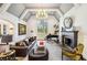 Bright living room offers vaulted ceilings, a fireplace, hardwood floors, and a grand piano near a window at 105 Kingston Mnr, Atlanta, GA 30342