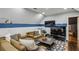 Cozy living room with a large sectional sofa and entertainment center at 105 Kingston Mnr, Atlanta, GA 30342