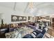 Spacious living area featuring high ceilings, stylish furnishings, and seamless flow to the gourmet kitchen at 105 Kingston Mnr, Atlanta, GA 30342