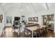Open-concept living and dining area featuring vaulted ceilings, modern lighting, and seamless flow at 105 Kingston Mnr, Atlanta, GA 30342