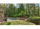 Gorgeous pool with stone features including a slide, waterfall, and spa at 105 Kingston Mnr, Atlanta, GA 30342