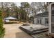 Spacious backyard featuring a stone patio, fire pit, and covered area at 27 Spence Ne Ave, Atlanta, GA 30317