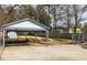 Backyard with covered parking, garden, and well-maintained landscaping at 27 Spence Ne Ave, Atlanta, GA 30317