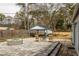 Backyard with stone patio featuring a covered area, fire pit, and garden at 27 Spence Ne Ave, Atlanta, GA 30317