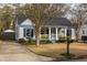 Charming home with a welcoming front porch and manicured landscaping at 27 Spence Ne Ave, Atlanta, GA 30317