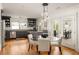 Kitchen, dining area featuring stainless steel appliances, granite countertops, and hardwood floors at 27 Spence Ne Ave, Atlanta, GA 30317