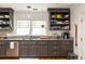 Updated kitchen with stainless appliances, granite counters, open shelving, and ample storage space at 27 Spence Ne Ave, Atlanta, GA 30317