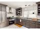 Well-equipped kitchen featuring granite countertops, stainless steel appliances, and subway tile backsplash at 27 Spence Ne Ave, Atlanta, GA 30317