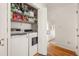 Convenient laundry room featuring a washer, dryer, and storage shelves at 27 Spence Ne Ave, Atlanta, GA 30317