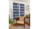 Charming living room with built-in bookshelves, creating a cozy atmosphere with hardwood floors and stylish decor at 27 Spence Ne Ave, Atlanta, GA 30317