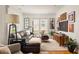 Cozy living room featuring a comfortable sofa, stylish decor, and ample natural light streaming through the windows at 27 Spence Ne Ave, Atlanta, GA 30317