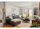 Comfortable living room with hardwood floors, natural light, and stylish furnishings, perfect for relaxing at 27 Spence Ne Ave, Atlanta, GA 30317