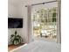 Sun-filled bedroom features a large window overlooking the outdoor patio at 27 Spence Ne Ave, Atlanta, GA 30317