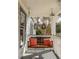 Inviting porch featuring a cozy swing with vibrant orange pillows, perfect for relaxation and enjoying the outdoors at 27 Spence Ne Ave, Atlanta, GA 30317