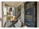 Charming front porch with seating area, elegant lanterns, and a stylish front door, enhancing curb appeal at 27 Spence Ne Ave, Atlanta, GA 30317