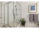 Modern bathroom with walk-in shower and patterned tile floor at 27 Spence Ne Ave, Atlanta, GA 30317