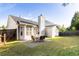 Serene backyard with patio, ideal for relaxation, surrounded by lush greenery and privacy fence at 4924 Antelope Cv, Atlanta, GA 30349