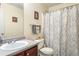 Well-lit bathroom features a single sink vanity with a shower and tub combination at 4924 Antelope Cv, Atlanta, GA 30349