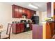 Well-equipped kitchen boasts dark wood cabinets and black appliances for a modern feel at 4924 Antelope Cv, Atlanta, GA 30349