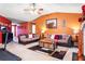 Inviting living room with comfortable seating, rich paint colors, and a decorative fireplace at 4924 Antelope Cv, Atlanta, GA 30349