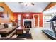 Inviting living room with a cozy fireplace, warm colors, and plenty of natural light at 4924 Antelope Cv, Atlanta, GA 30349