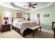 Spacious main bedroom features a tray ceiling, neutral walls, and plush carpet at 4924 Antelope Cv, Atlanta, GA 30349