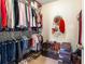 Walk-in closet with ample hanging space and built-in shelving for storage at 4924 Antelope Cv, Atlanta, GA 30349
