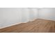 Unfinished basement with wood-look flooring and minimal lighting, perfect for storage or renovation at 5000 Northland Sw Rd, Mableton, GA 30126