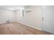 Spacious basement area with light laminate flooring, a window, and mini split for heating and cooling at 5000 Northland Sw Rd, Mableton, GA 30126