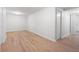 Unfinished basement area with wood-look flooring and a partially visible closet at 5000 Northland Sw Rd, Mableton, GA 30126