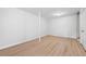 Unfinished basement space with wood-look flooring and a support beam in the middle of the room at 5000 Northland Sw Rd, Mableton, GA 30126