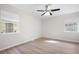 Bedroom with wood-look floors, two windows, and a ceiling fan at 5000 Northland Sw Rd, Mableton, GA 30126