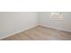 Light and airy bedroom with wood-look floors and a window with a view of the exterior at 5000 Northland Sw Rd, Mableton, GA 30126