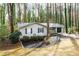 Charming single-story home with black accents, garage, and well-manicured front yard at 5000 Northland Sw Rd, Mableton, GA 30126