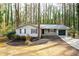 Charming single-story home featuring a well-manicured front yard and an attached one car garage at 5000 Northland Sw Rd, Mableton, GA 30126