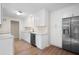 Bright kitchen features white cabinets, stainless steel appliances, and a subway tile backsplash at 5000 Northland Sw Rd, Mableton, GA 30126