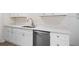 Kitchen featuring white cabinets, stainless steel appliances, quartz countertops, and wood-look floors at 5000 Northland Sw Rd, Mableton, GA 30126