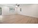 Bright and spacious living room featuring hardwood floors, a modern ceiling fan and a sliding door at 5000 Northland Sw Rd, Mableton, GA 30126